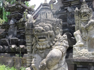 Puras all over Bali have various statues from both Balinese Hinduism and the older animism.  This one was guarding an ancillary temple, where the people were preparing everything for the Pura.