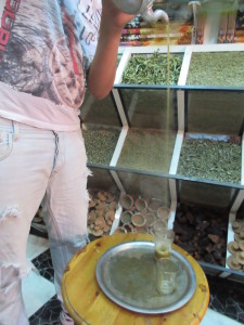 Locals pour the hot tea from on high to cool it before it hits the cup.  